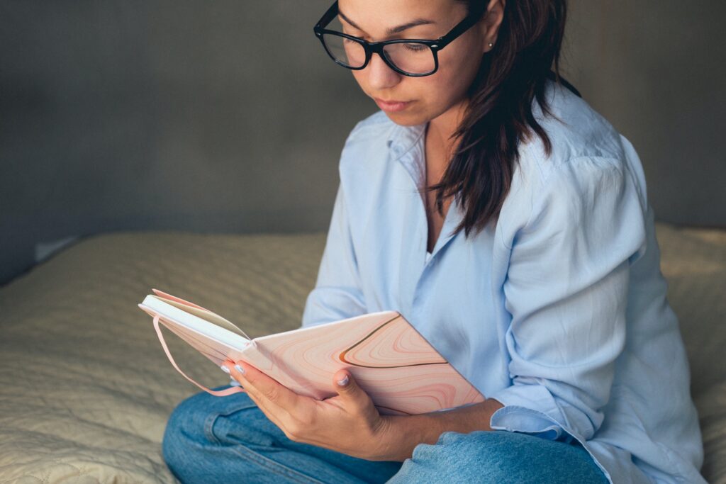 Relaxed happy woman reading a book